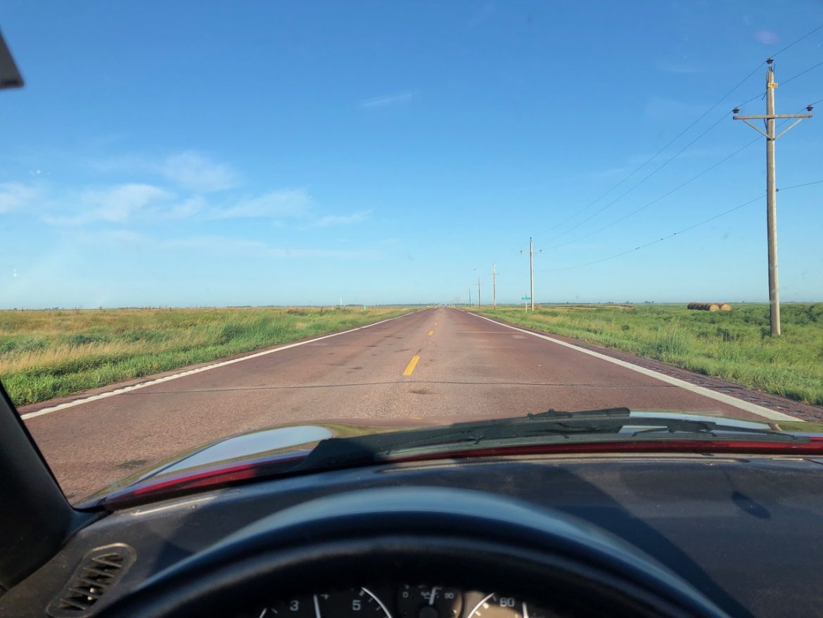 Vehicle Dash Looking Into Prairie Landscape